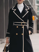 Black Lumina Vancouver Colleen double-breasted belted long coat displayed on a model, featuring a tailored silhouette and classic design.
