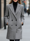 Black Enid double-breasted checked wool coat by Lumina Wear, shown on a model, featuring classic plaid pattern and tailored fit.