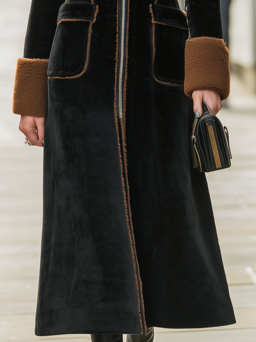 Black Lumina Vancouver Beatrix long plush coat with elegant contrast trim, shown on a model with a stylish, cozy look.