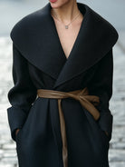 Black Lumina Vancouver Elena shawl-collar wrap coat with faux leather belt, showing the stylish collar and belted waist.