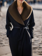 Black Lumina Vancouver Wool Coat with oversized fur collar, slim fit design, displayed on a model.