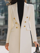 White Bernadette double-breasted blazer coat with gold button details, styled by Lumina Vancouver, shown on a model.