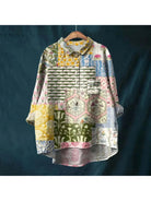 Gray Natasha Art Elegant Floral Blouse from Lumina Vancouver's collection, featuring intricate floral patterns and a stylish blouse design.