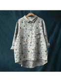 Gray floral blouse named Natasha by Lumina Wear, featuring elegant art-inspired floral print, worn as a stylish women's shirt.