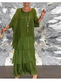 Dark green Caroline loose round neck dress by Lumina Wear, featuring a relaxed fit and casual style, shown on a model.