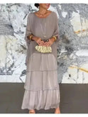 Dark green loose round neck dress by Lumina Wear, featuring a relaxed fit and simple neckline, styled for casual wear.