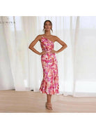 Orange floral patterned dress by Lumina Vancouver featuring a stylish, flowy design perfect for casual or semi-formal wear.