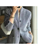 Beige Lumina Wear Nela knitted cardigan with a cozy, textured knit pattern and front button closure.