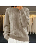 Beige Lumina Wear Camila elegant knit sweater with a fitted design, showcased on a model in a stylish indoor setting.