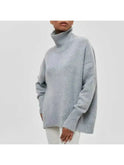 Lumina Wear Mia cozy blue turtleneck sweater, soft knit fabric, shown on a model, perfect for casual and cold weather wear.