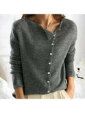 Light grey Lumina Wear Malu knitted sweater, close-up of cozy knit fabric and relaxed fit, worn by model.