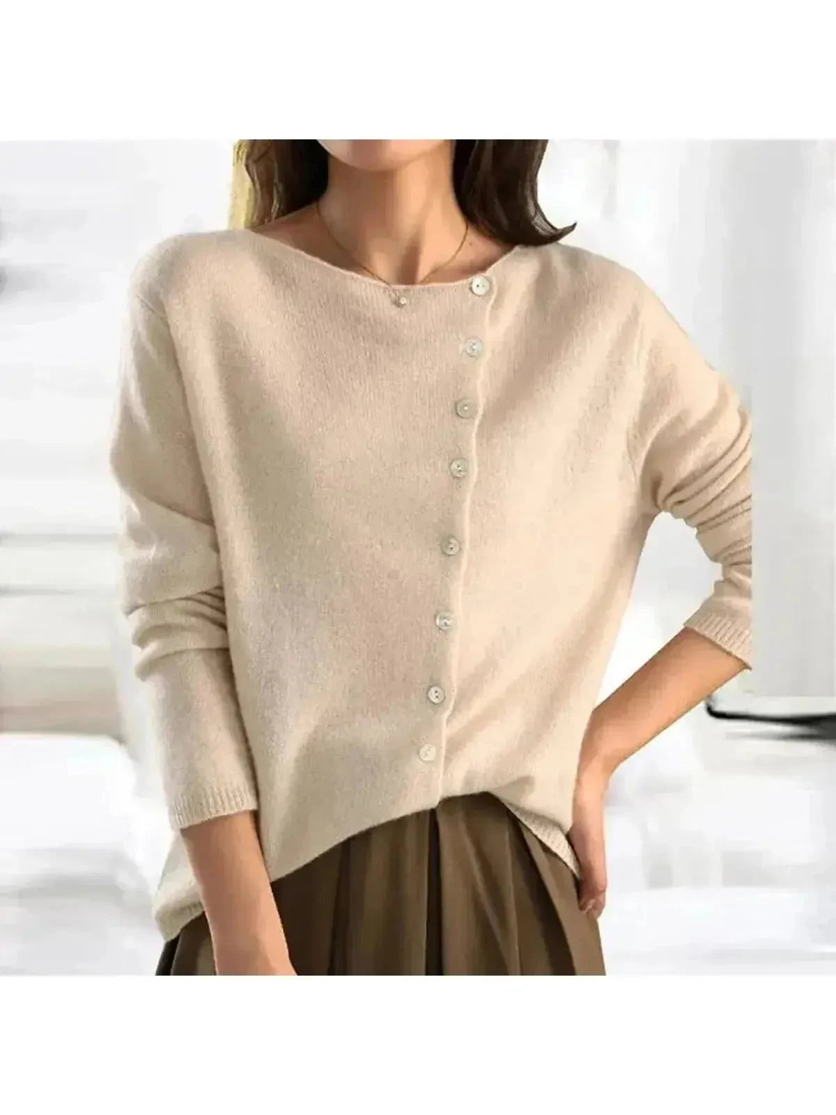 Light grey Malu knitted sweater by Lumina Wear, featuring soft knit fabric and a cozy fit, displayed on a white background.