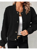 Light grey Amaia cardigan by Lumina Wear, shown on a hanger with a cozy knit texture and button details.