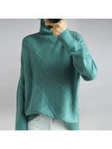 Lumina Wear Nora turtleneck sweater in khaki, showcasing its cozy fit and ribbed collar on a neutral background.