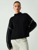 Lumina Wear Riley knitted sweater in cozy wool, featuring a classic crewneck and ribbed cuffs, perfect for casual wear.