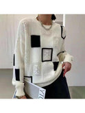 Lumina Wear Rema Geometric Pullover sweater in white, featuring a modern geometric design, displayed on a mannequin.