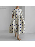 Lumina Vancouver Amelia floral dress with vibrant flower print, lightweight fabric, and elegant fit for casual or semi-formal wear.