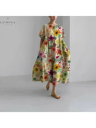 Lumina Vancouver Amelia floral dress with colorful flower print, sleeveless design, lightweight fabric, and feminine style.