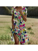 Lumina Wear Callie spring dress with a vibrant floral pattern, lightweight fabric, and a flattering fit perfect for warm weather.