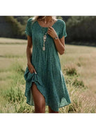 Lumina Vancouver Callie spring dress with a colorful floral pattern, lightweight fabric, and a relaxed fit for warm weather.