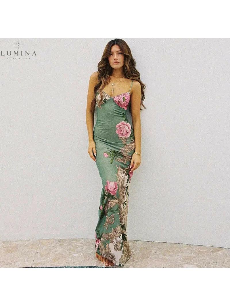 Lumina Vancouver Gaia Flower Dress with holiday vibes in green, featuring floral patterns and lightweight fabric for festive occasions.