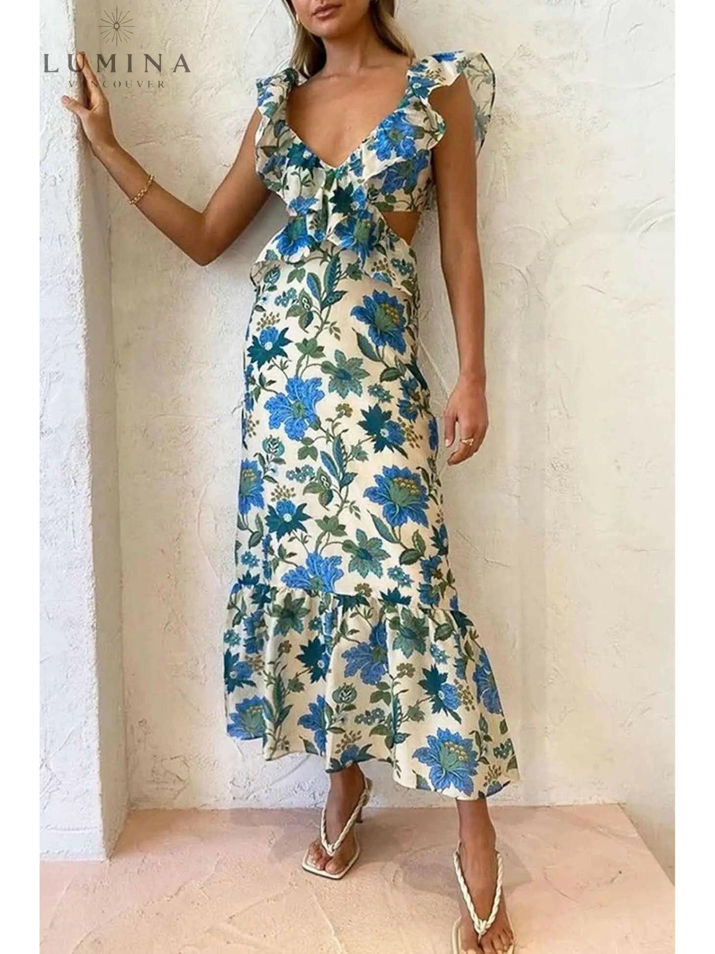 A young girl wearing the Lumina Vancouver Ariella floral ruffle dress in orange, perfect for holiday occasions, size 4-6 XS.