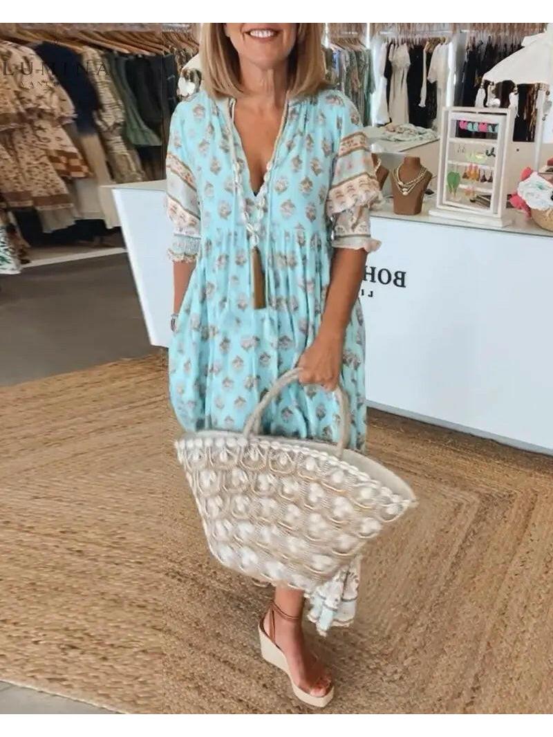 Blue vintage spring dress by Lumina Vancouver, featuring a classic jurk style with floral details and a fitted waist.