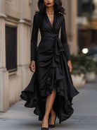Navy blue satin maxi dress with ruffle hem from Lumina Wear, featuring a flowing silhouette and elegant design.