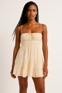 Lumina Wear Valence mini dress with smocked bust, straps, in apricot color, featuring a fitted silhouette and adjustable straps.