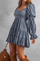 Apricot off-shoulder mini dress by Lumina Vancouver, featuring a stylish and fitted design perfect for summer or casual occasions.
