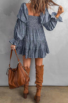 Apricot off-shoulder mini dress by Lumina Vancouver, featuring a stylish and feminine design perfect for summer occasions.