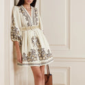 Apricot embroidered boho mini dress by Lumina Wear featuring intricate marigold embroidery and a relaxed, stylish fit.