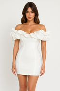 Black and white Aurora off-shoulder mini dress by Lumina Wear, featuring a stylish, fitted silhouette and elegant neckline.