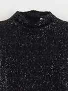 Black sequin embellished mini dress by Lumina Vancouver, featuring a fitted silhouette and stylish design.