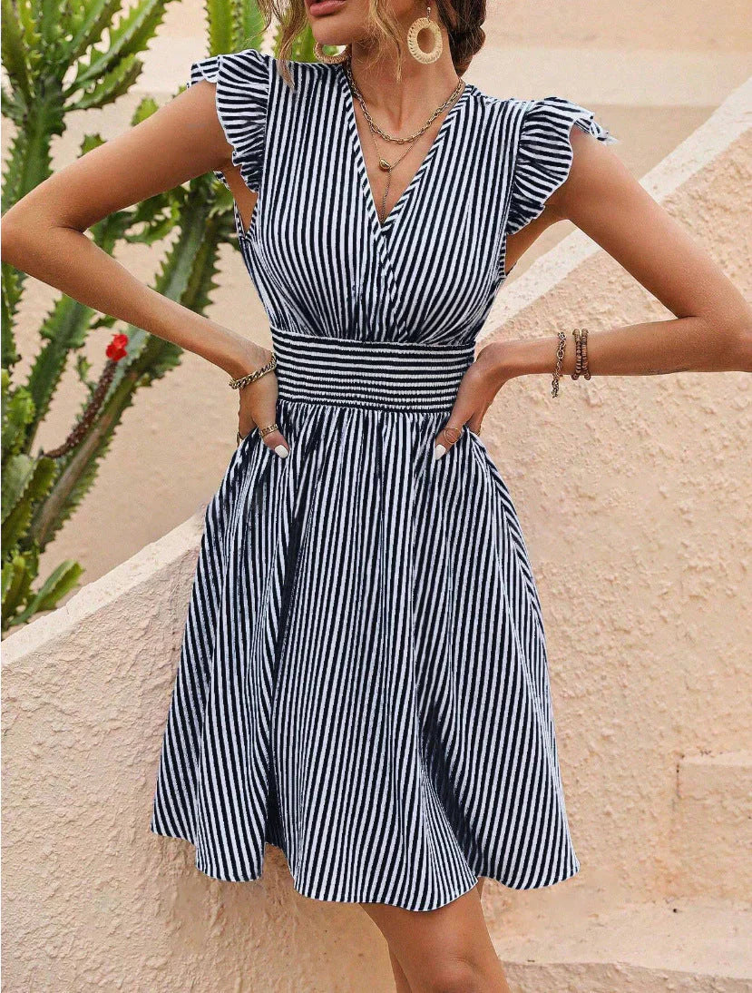 Black Rauha Nightingale wrap dress by Lumina Vancouver, stylish mini dress with a flattering fit and elegant design.