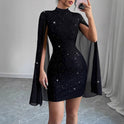 Black Aurora Belle Celeste mini cape dress by Lumina Wear, featuring a stylish design and elegant cape detail.