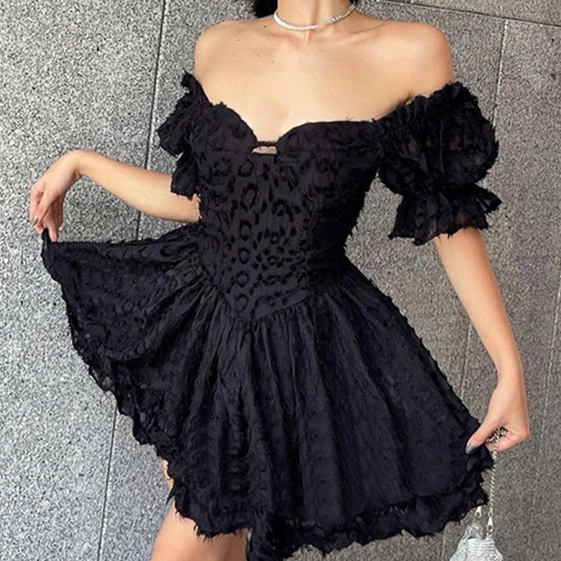 Black off-shoulder mini dress by Lumina Wear, featuring a fitted silhouette and stylish design from Lumina Vancouver.