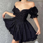 Black Aino off-shoulder mini dress by Lumina Vancouver, featuring a sleek fit and stylish neckline for a modern look.