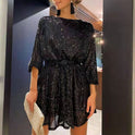 Black Celeste sequin mini dress by Lumina Wear, loose fit style, featuring shimmering sequins and elegant short length.