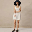 Black Celestina sleeveless mini dress by Lumina Vancouver, featuring a fitted bodice and stylish mini length.