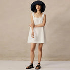 Black Celestina sleeveless mini dress by Lumina Vancouver, featuring a fitted silhouette and stylish sleeveless design.