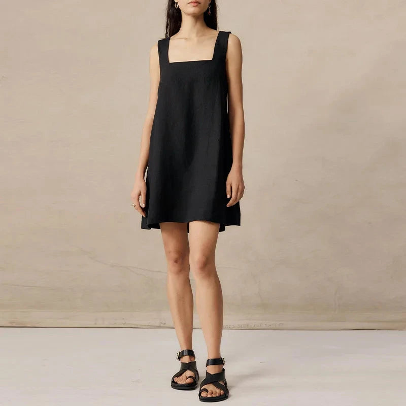 Black Celestina sleeveless mini dress by Lumina Vancouver, showcasing a fitted silhouette and stylish design.