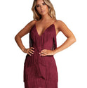 Black Lumina Wear Kai mini dress with fringed detailing, shown on a model, highlighting its stylish and trendy design.