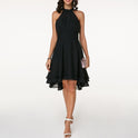 Black Lyra halter neck mini dress by Lumina Wear featuring a layered skirt, shown on a model.
