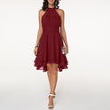 Black Lumina Wear Lyra halter neck mini dress with layered skirt, featuring a stylish halter design and flowing fabric.