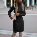 Black Lumina Wear Lyra mini dress with turtleneck and cable knit design, showing a close-up of the textured fabric and fitted silhouette.