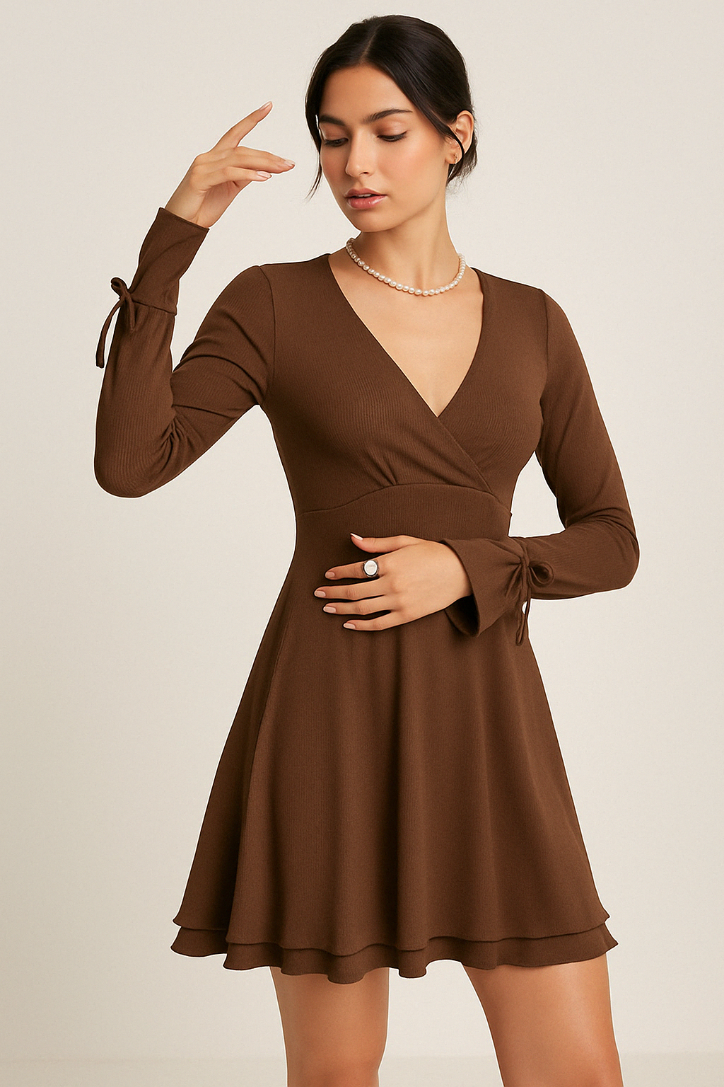 Black Gwyneth mini dress with flared sleeves and deep V-neck by Lumina Vancouver, shown on a model.