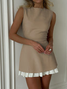 Black Lumina Vancouver mini dress with a pleated skirt, featuring a fitted bodice and stylish design, perfect for casual or semi-formal wear.