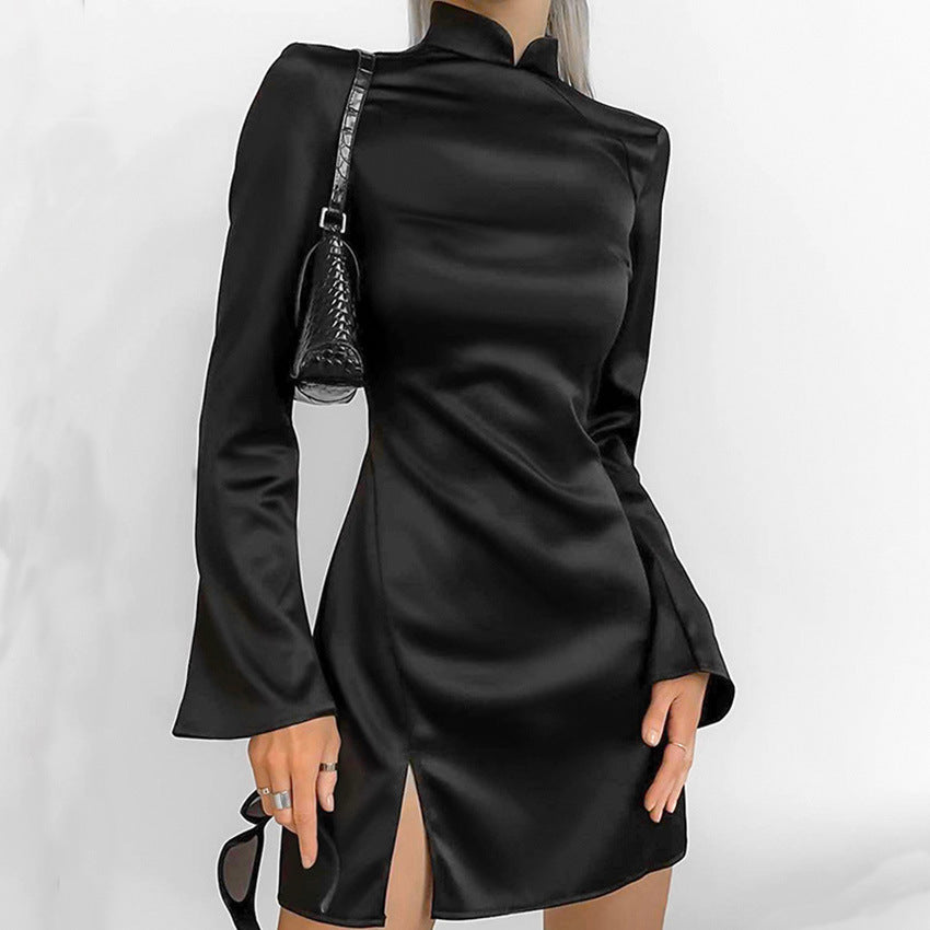 Black satin Lumina Wear Vesna mini dress, form-fitting style, shown on a model with elegant neckline and sleek silhouette.
