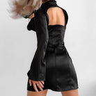 Black Lumina Vancouver Vesna satin mini dress showing a sleek, form-fitting silhouette with a smooth, shiny fabric finish.